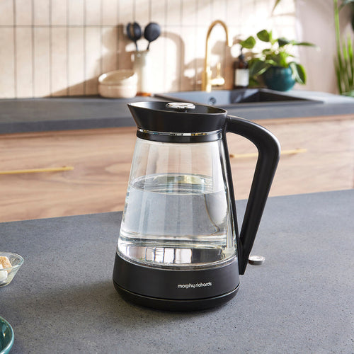 Black and clear glass electric kettle on a kitchen counter