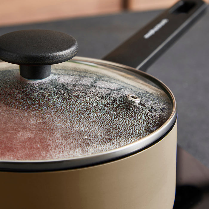 Close-up of a pot with a lid on a stove