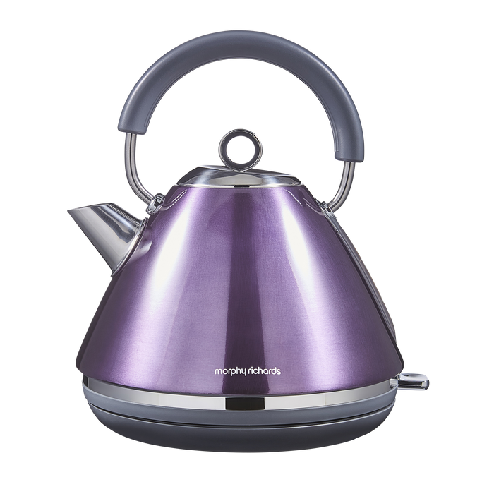 Purple electric kettle with a gray handle on a white background