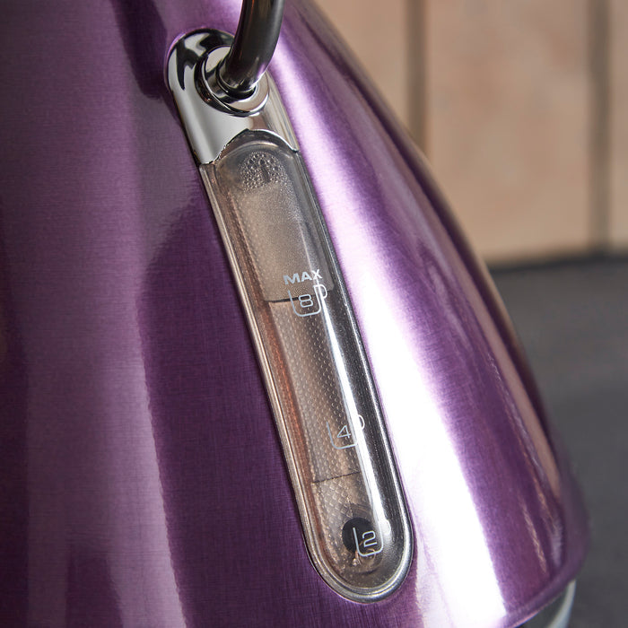 Close-up of a purple electric kettle with control buttons.