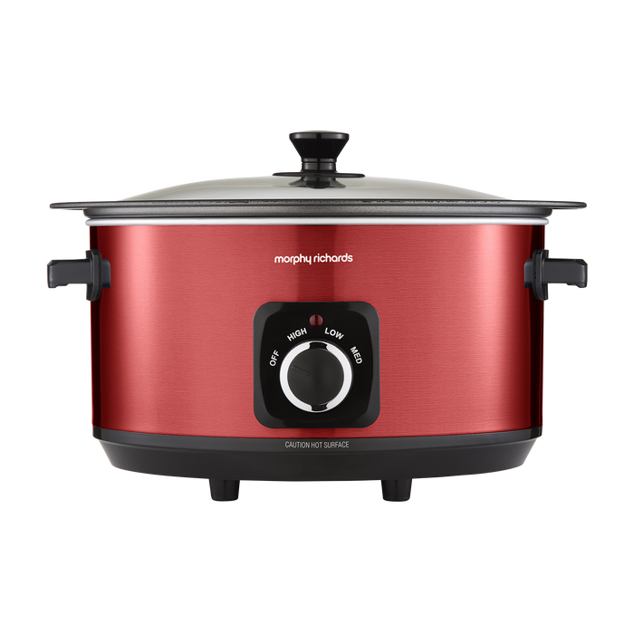 Red slow cooker with black control panel on a white background