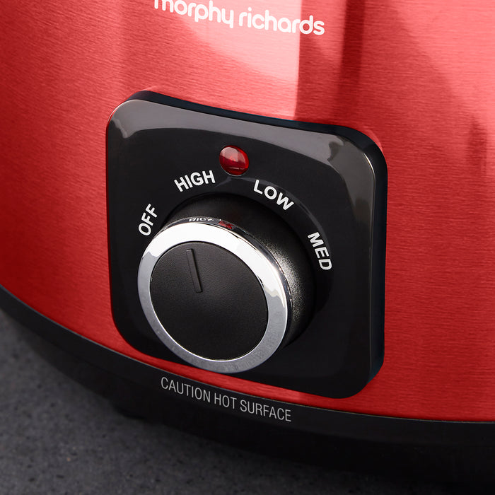 Control knob with 'Morphy Richards' branding on a red appliance.