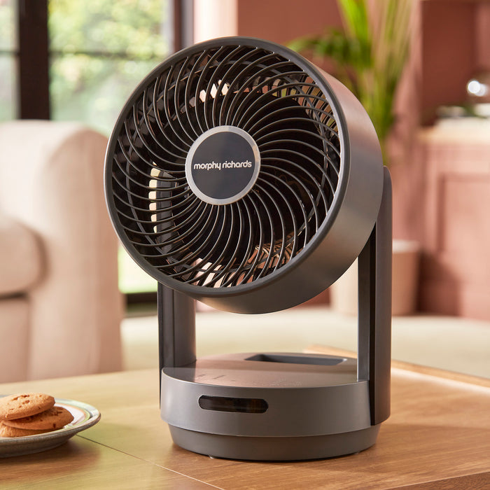 grey fan on coffee table in living room