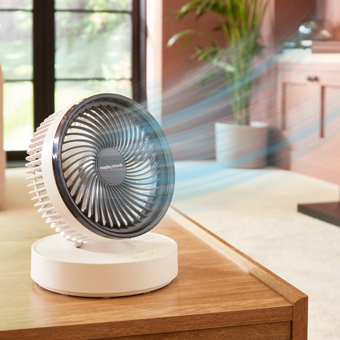 Air Flex 6” Portable Oscillating Rechargeable USB Fan on a coffee table
