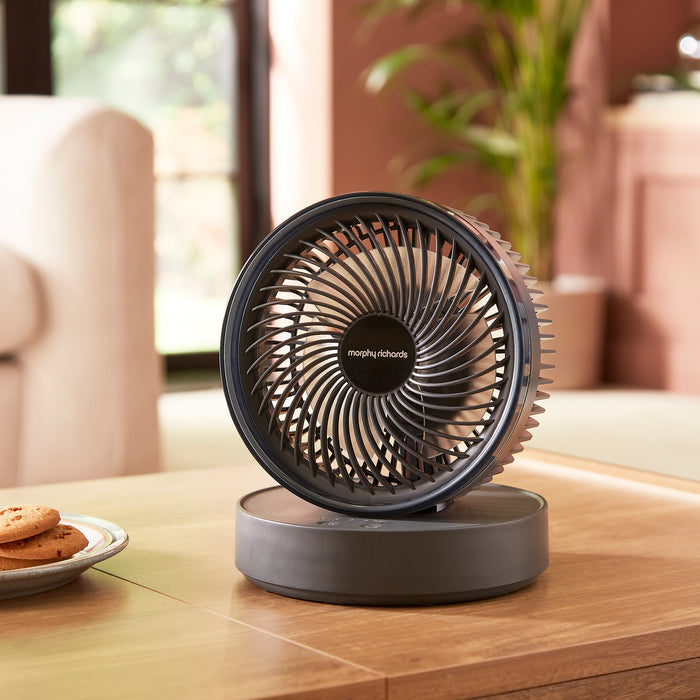 Air Flex 6” Portable Oscillating Rechargeable USB Fan in grey on a coffee table