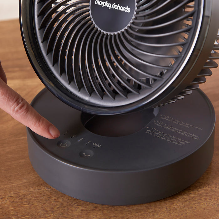 Pressing the on button, on the Air Flex 6” Portable Oscillating Rechargeable USB Fan