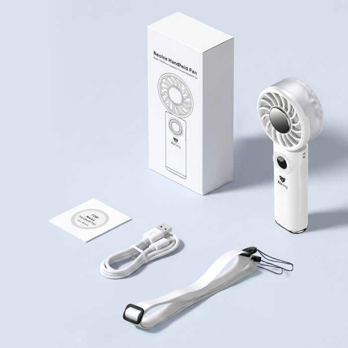Handheld AirDog fan with packaging, cable, and manual on a light gray background