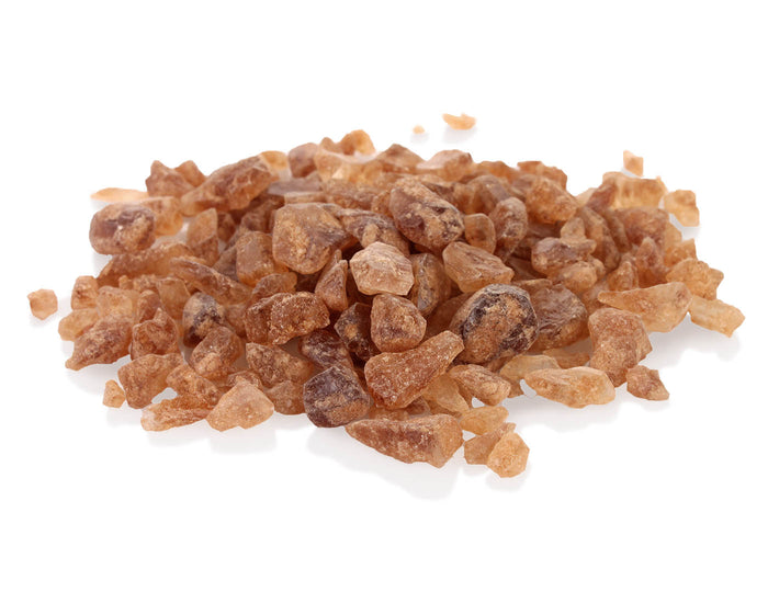 Amber tea sugar granules closeup