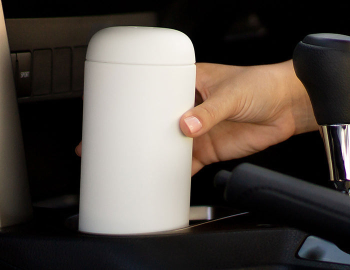 Carter Infuser Set 16oz Matte White, placing into a car cupholder