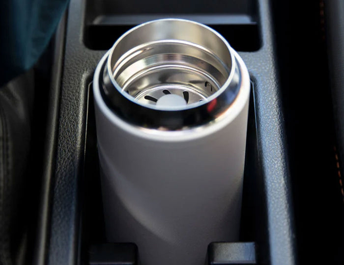 Carter Infuser Set 16oz Matte White, open, in a car cupholder