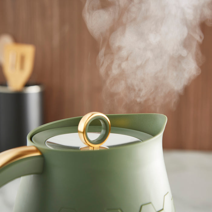 close up of steam coming out with green kettle
