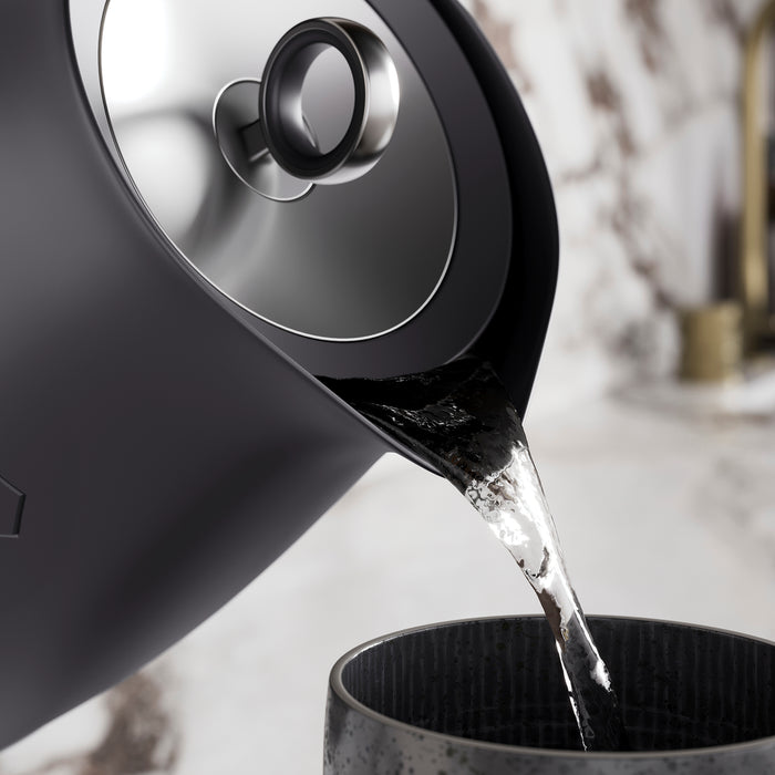 Black kettle pouring water