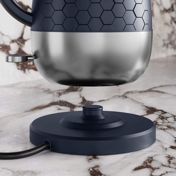 Blue Kettle hovering above Hot plate.