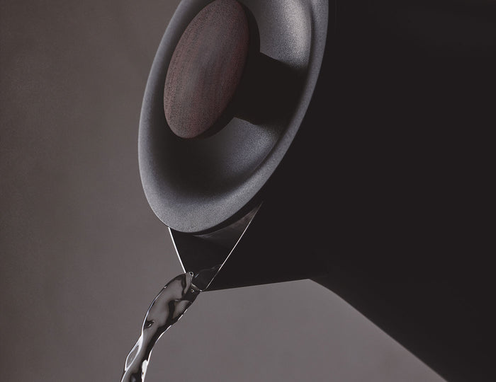 MAIN PDP | Detail of Pouring hot water from the Black Corvo Kettle EKG Pro on dark background
