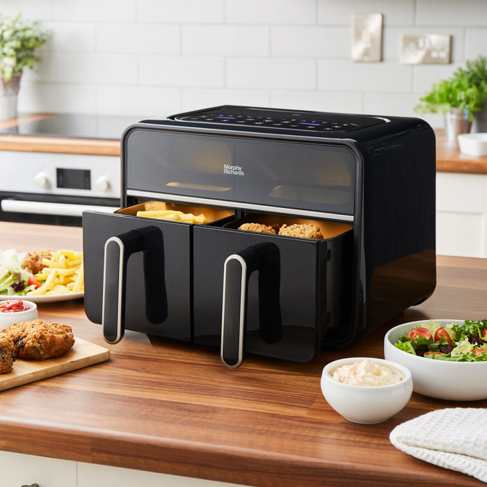 dual air fryer with drawers open on a kitchen counter