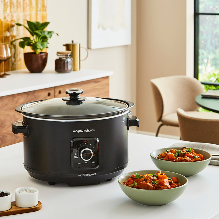 black slow cooker on kitchen table