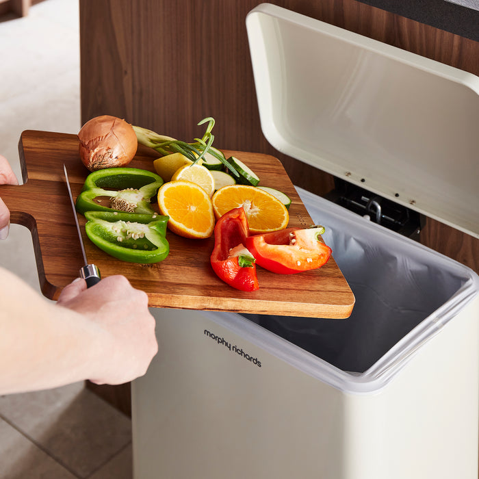 food going into a pedal bin