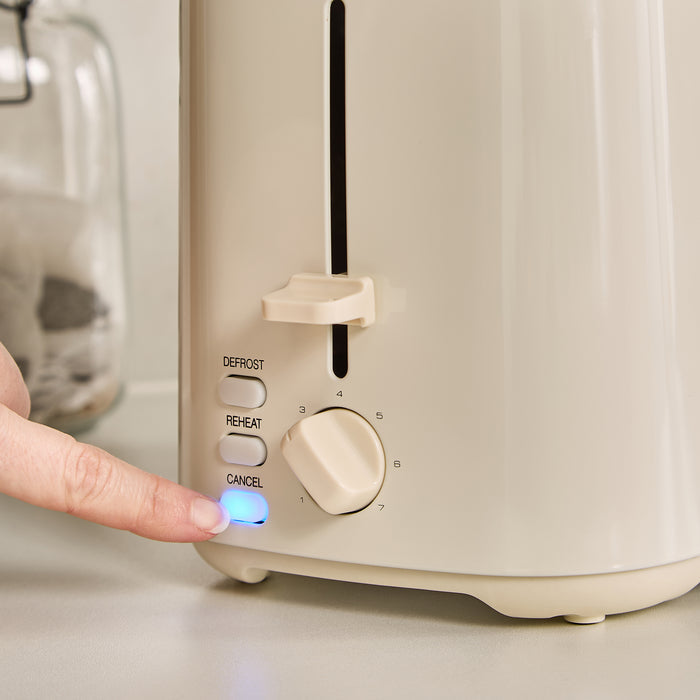 Beige toaster with control panel and hand pressing a button