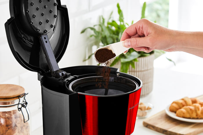 black and red filter coffee machine on kitchen counter