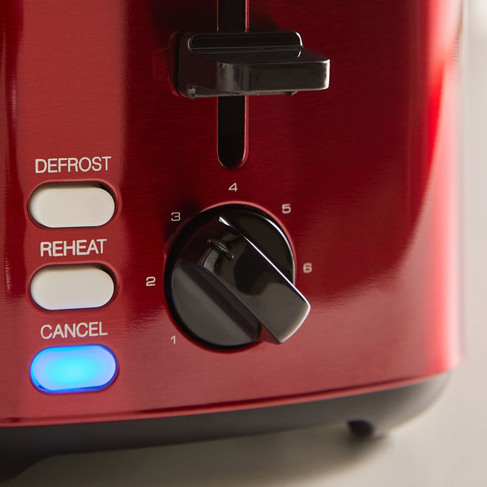 Red toaster with control buttons and a blue indicator light on a white background