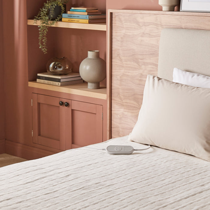 electric heat pad on bed