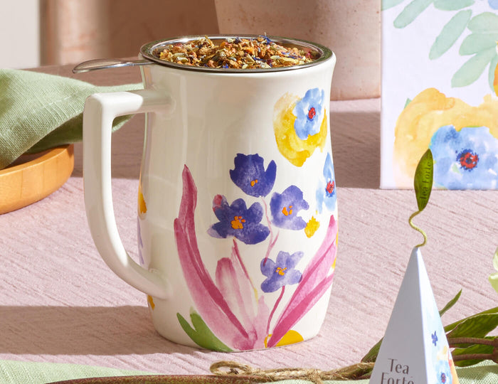 MAIN PDP | Volaré Fiore Steeping cup with an infuser basket inside filled with loose tea leaves