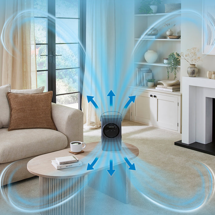 Air purifier in a living room with blue arrows indicating air movement