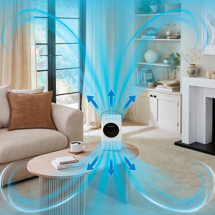 Air purifier in a living room with blue arrows indicating air movement