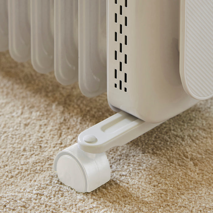 Portable electric space heater on a carpeted floor