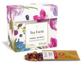 Tea Forte Herbal Retreat Single Steeps Sampler box, closed, with loose tea pouch, open, on a white background