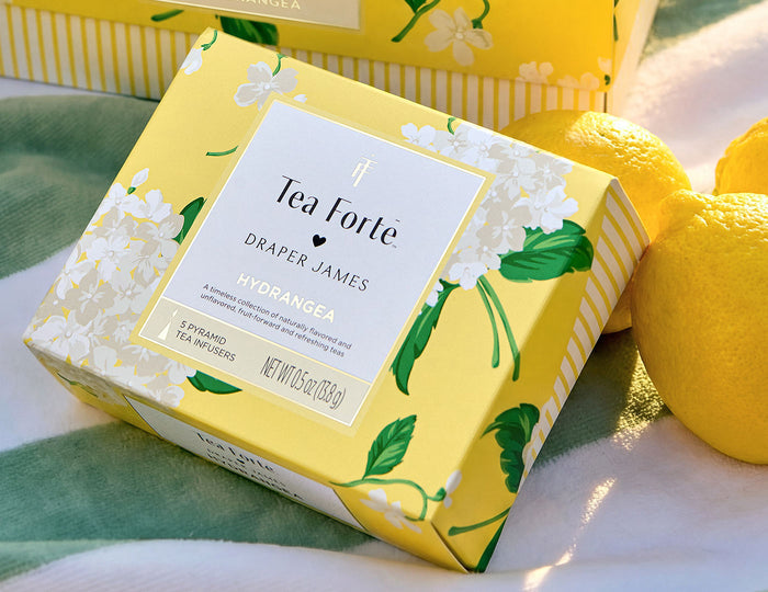 MAIN PDP | Tea Forte Draper James Hydrangea Mini Peite box on a table with lemons