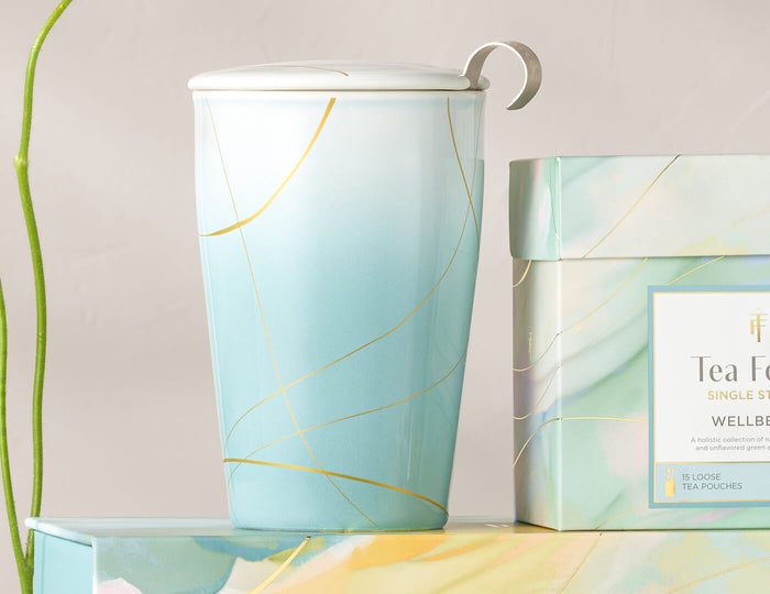 MAIN PDP | Wellbeing KATI® Steeping Cup with lid on and Single Steeps box next to it