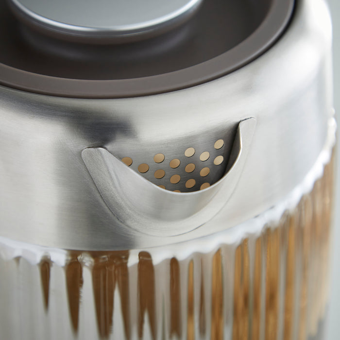 Close-up of a metallic object with circular patterns and a central feature.