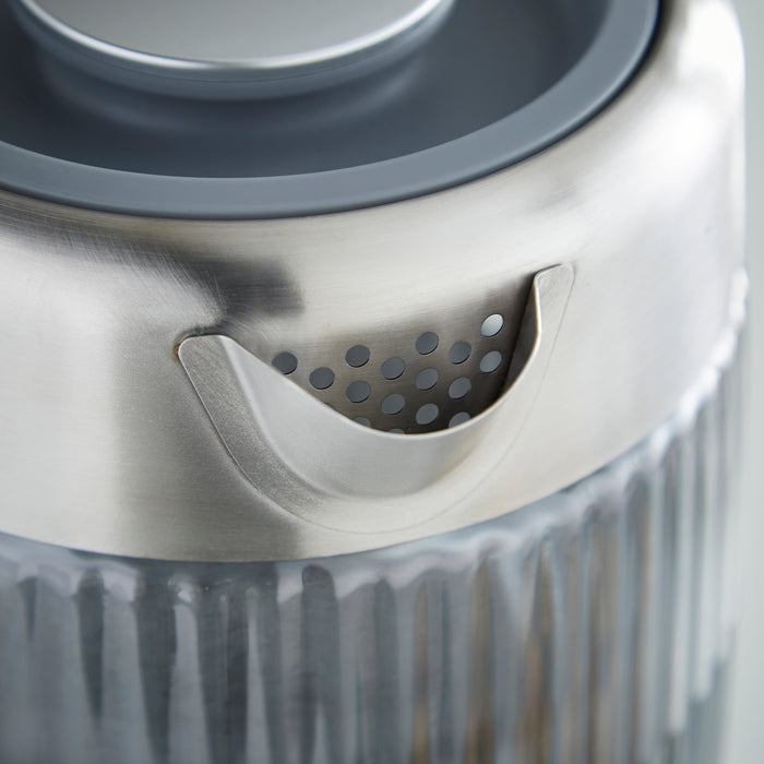 Close-up of a grey and silver Kettle object with a textured surface