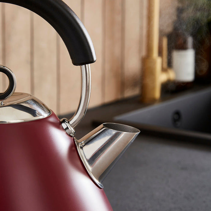 Close-up of a red kettle spout