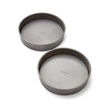 Two gray cake pans on a white background