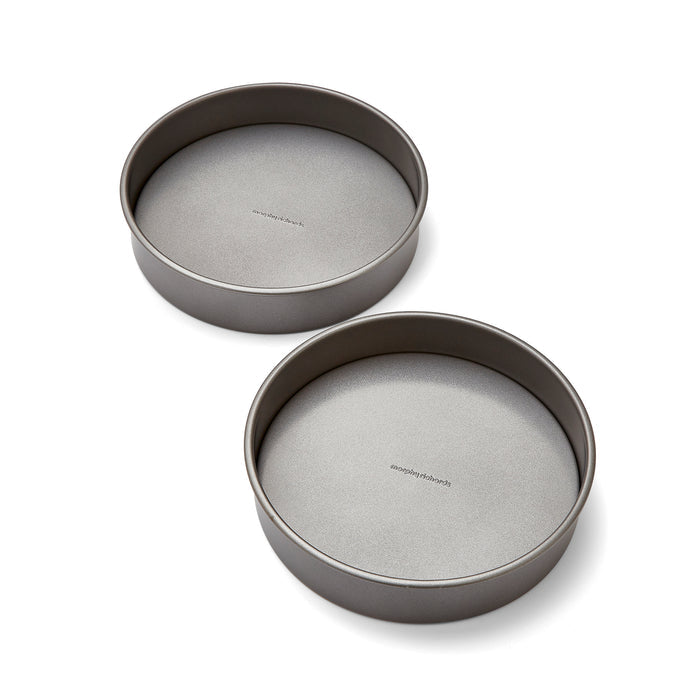 Two gray cake pans on a white background