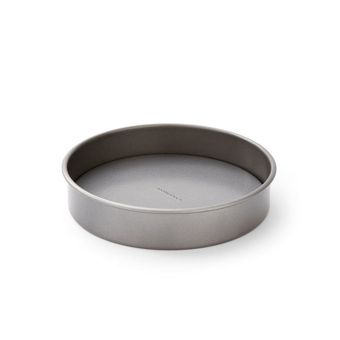 Metal cake pan on a white background