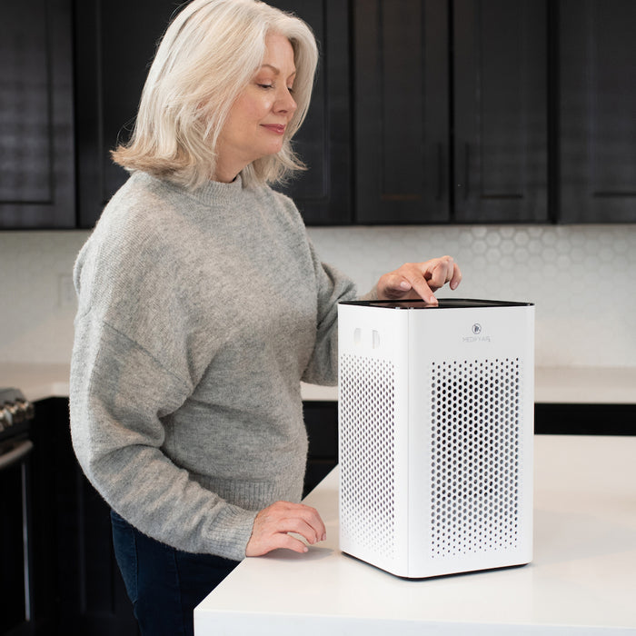 White rectangular MA-25 air purifier with black top and perforated front panel for effective air filtration
