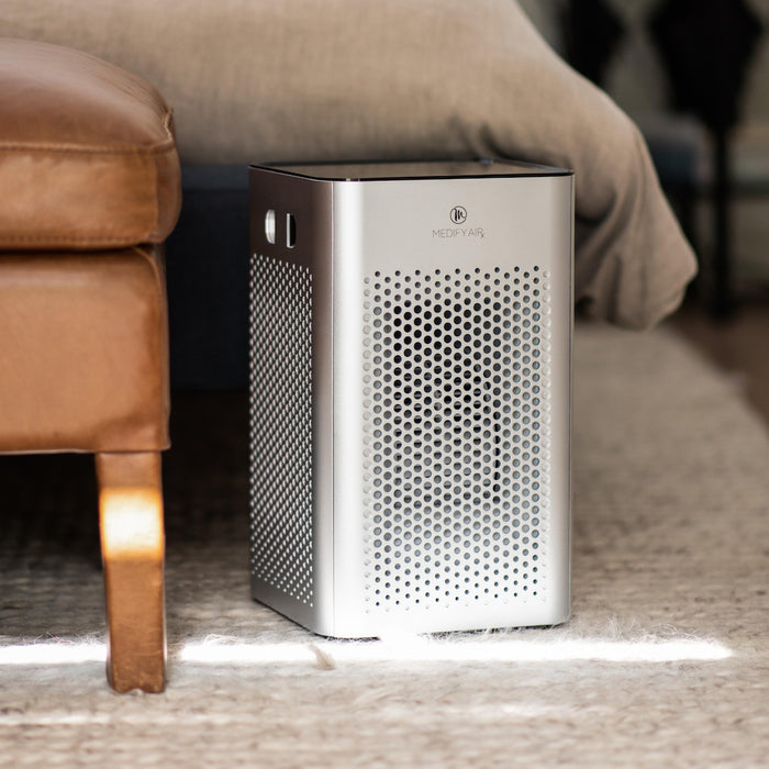 Silver metallic ma-25 air purifier with perforated front panel and sleek modern design for efficient air cleaning