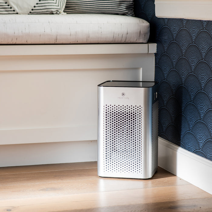 Silver rectangular ma-25 air purifier with perforated metal front panel and black top edge for clean air filtration
