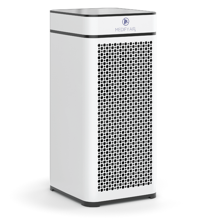 White rectangular ma-40 air purifier with black circular perforations and silver logo on the top panel