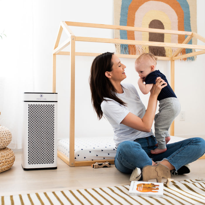 White rectangular MA-40 air purifier with black perforated front panel and minimalist design for clean air filtration