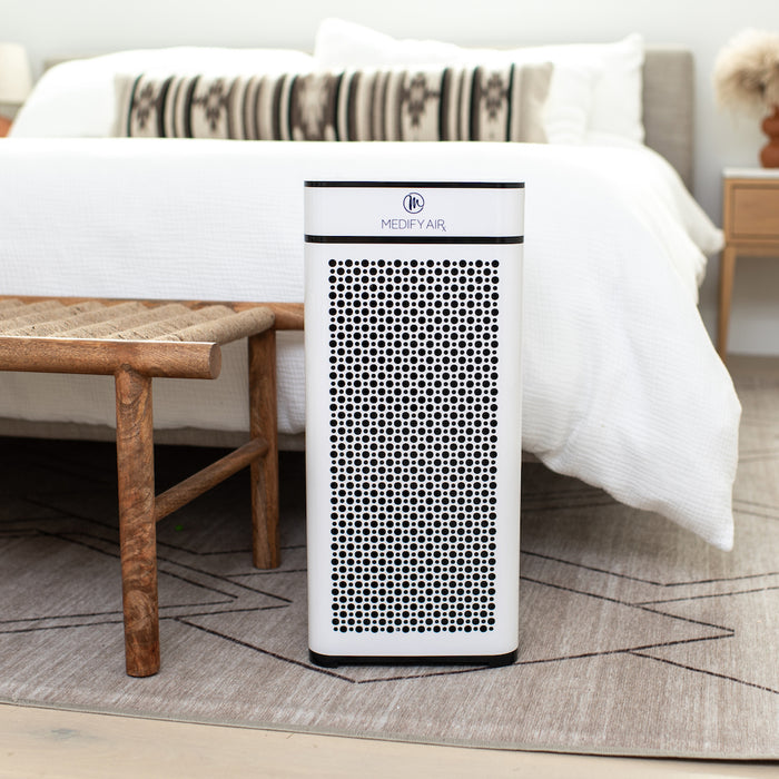 White rectangular medify air ma-40 air purifier with black perforated front panel for improved air filtration