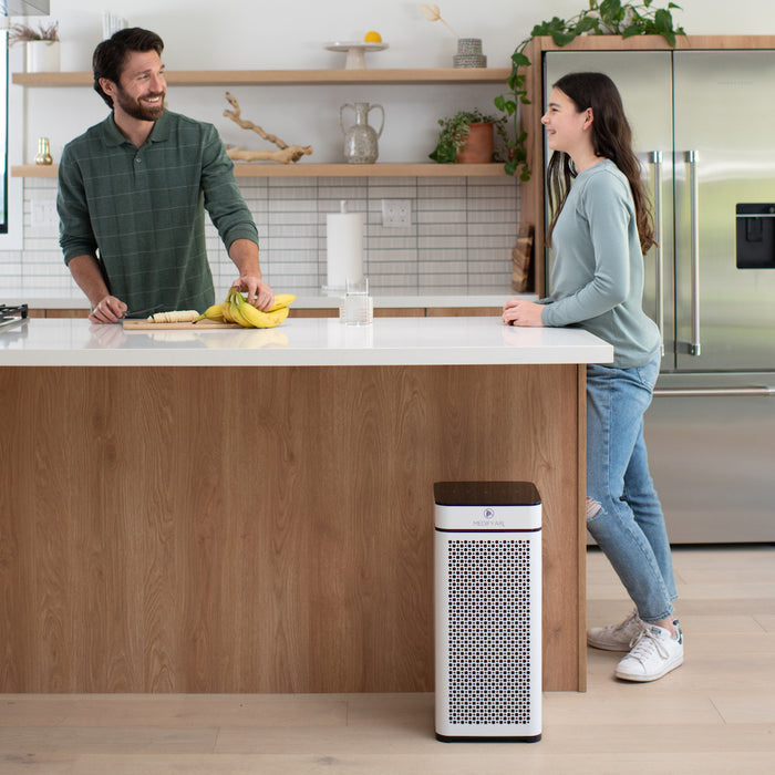 White and black ma-40 air purifier with perforated front panel for efficient air filtration in home or office spaces