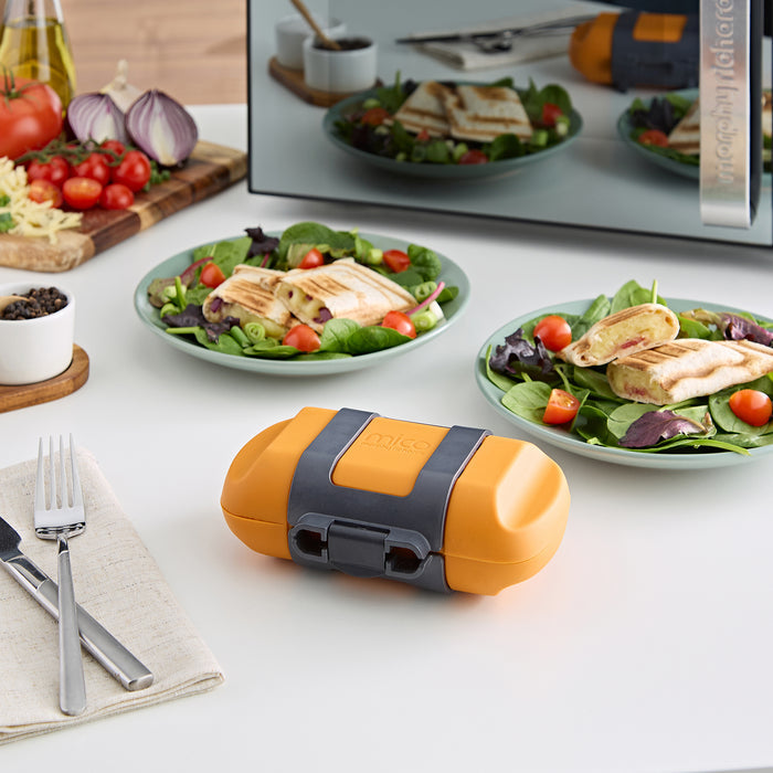 Microwave Toasted Wrap Maker with wraps on plates in the background