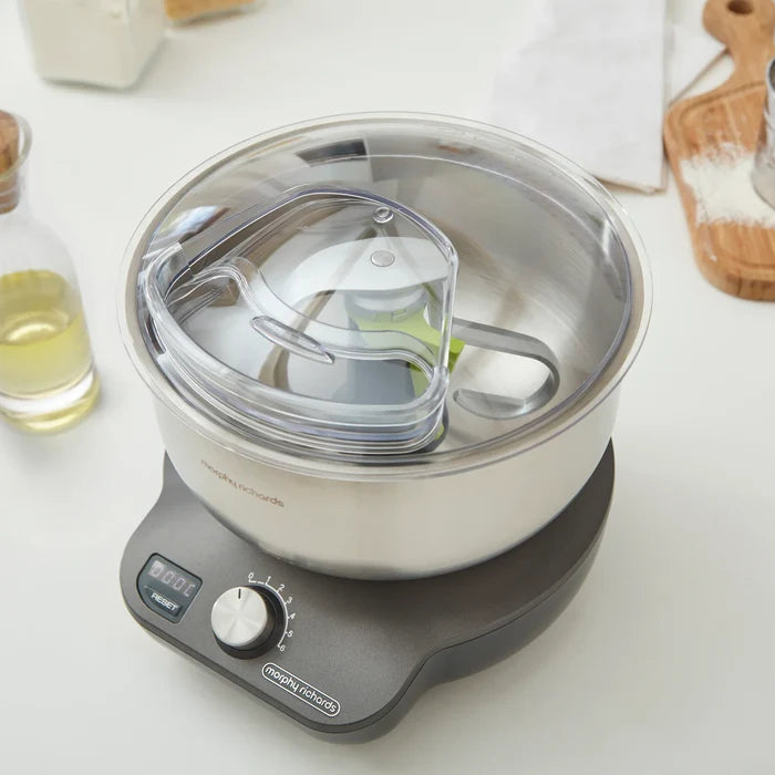 Food mixer with a clear container on a white surface