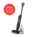 Vacuum cleaner with a bottle of cleaning solution on a white background