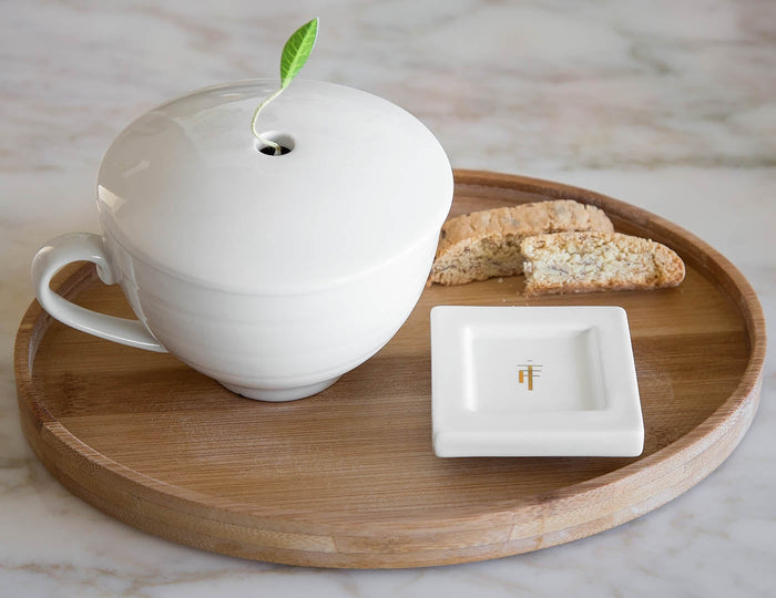 MAIN PDP | Bamboo oval tea tray showing tea cup on tray