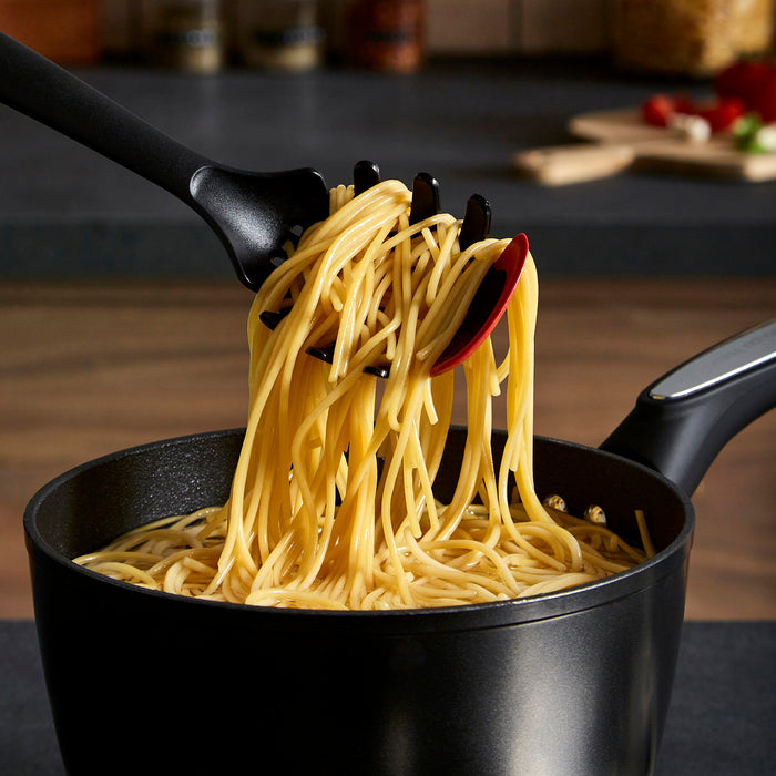 Pasta Server picking up spaghetti from the pan